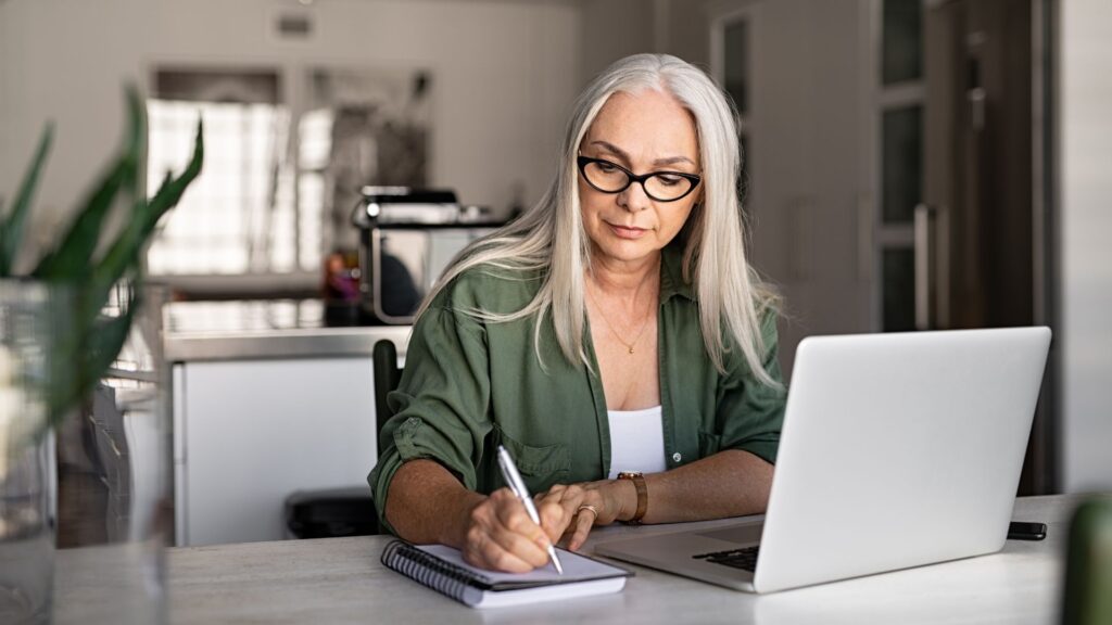 woman taking notes